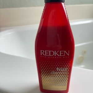 Redken Frizz Dismiss in Bold Red and Gold